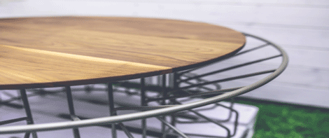 Circular wooden table with metal legs